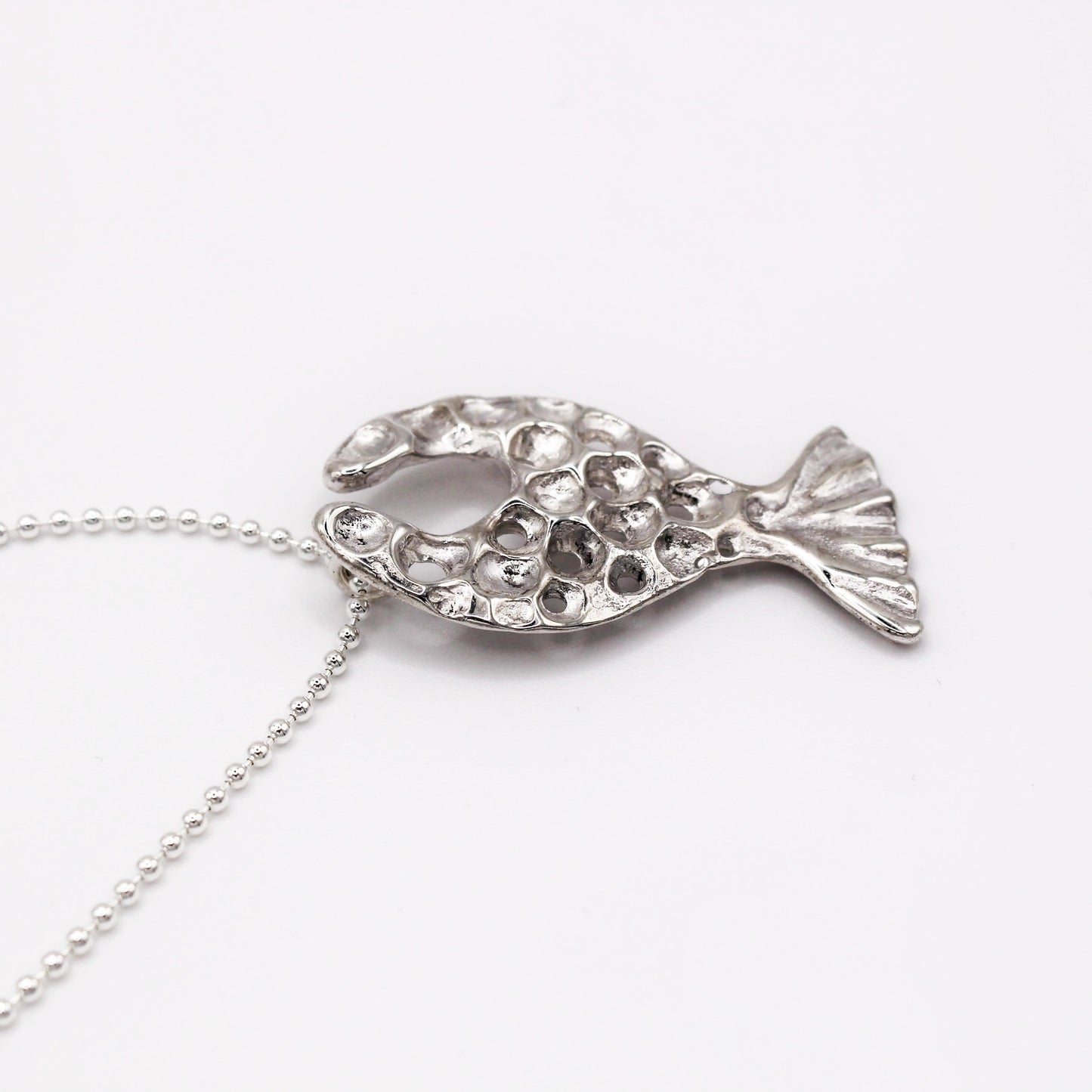 Handcrafted sterling silver fish pendant necklace, inspired by the Mediterranean Sea. A unique, organic design made using the lost wax casting technique. A timeless piece for ocean lovers and those who appreciate sustainable, nature-inspired jewelry, crafted by Naturalesa.