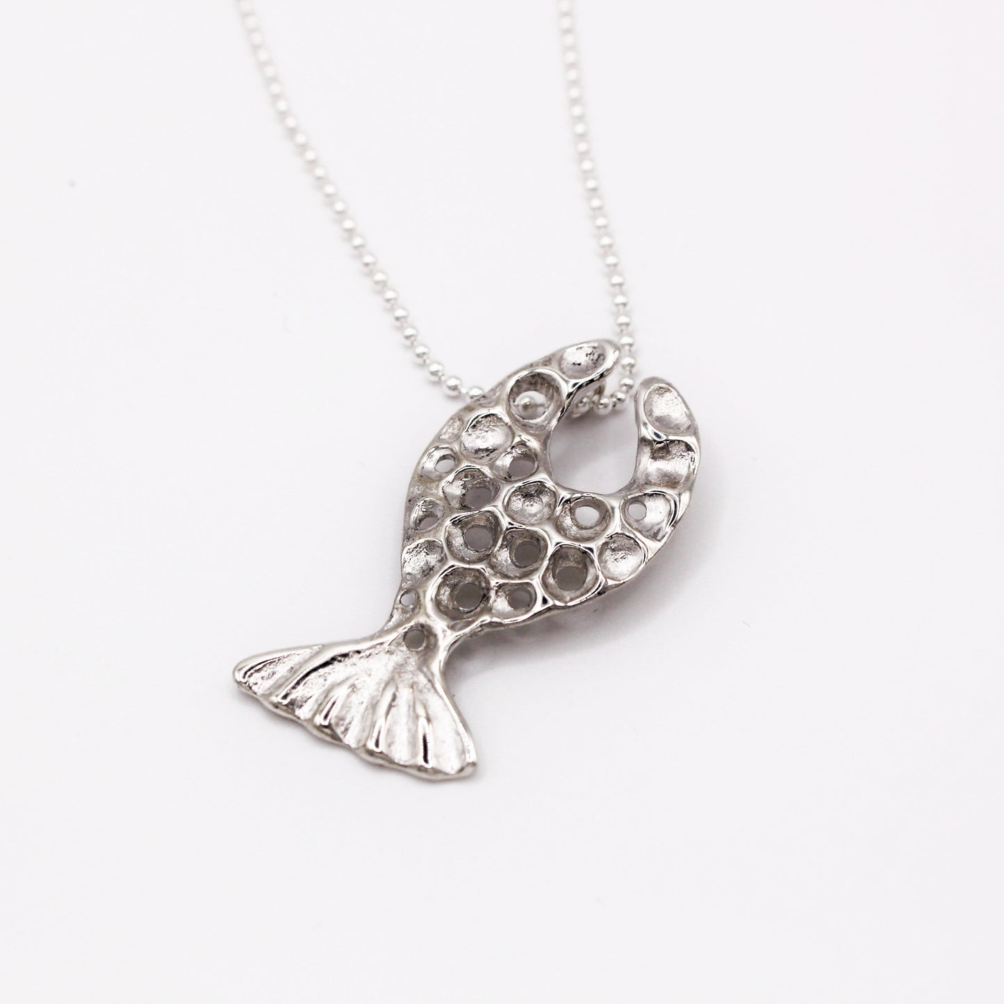 Handcrafted sterling silver fish pendant necklace, inspired by the Mediterranean Sea. A unique, organic design made using the lost wax casting technique. A timeless piece for ocean lovers and those who appreciate sustainable, nature-inspired jewelry, crafted by Naturalesa.
