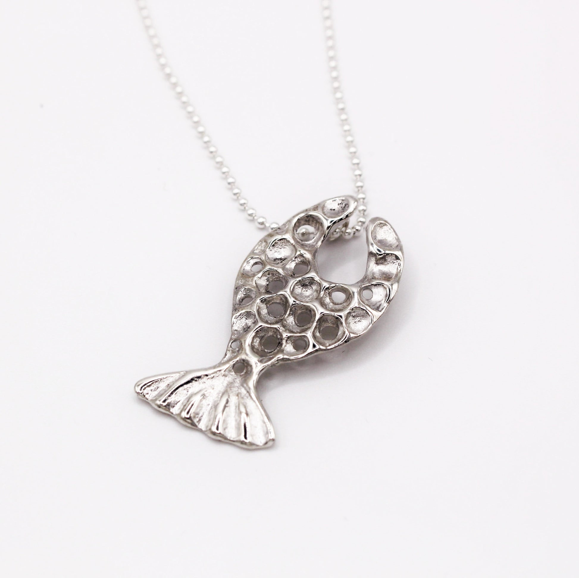 Handcrafted sterling silver fish pendant necklace, inspired by the Mediterranean Sea. A unique, organic design made using the lost wax casting technique. A timeless piece for ocean lovers and those who appreciate sustainable, nature-inspired jewelry, crafted by Naturalesa.