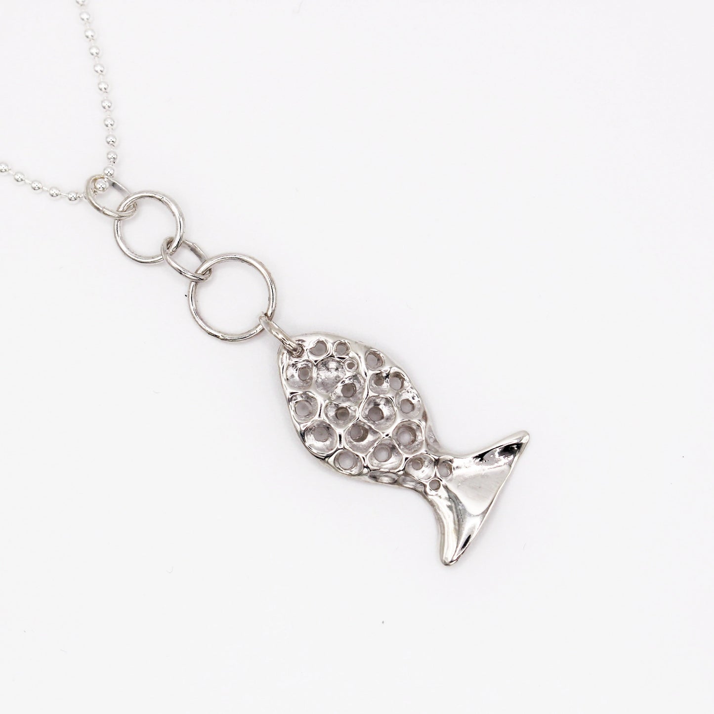 Mediterranean silver necklace with organic fish pendant symbolizing guidance and protection by Naturalesa Jewelry