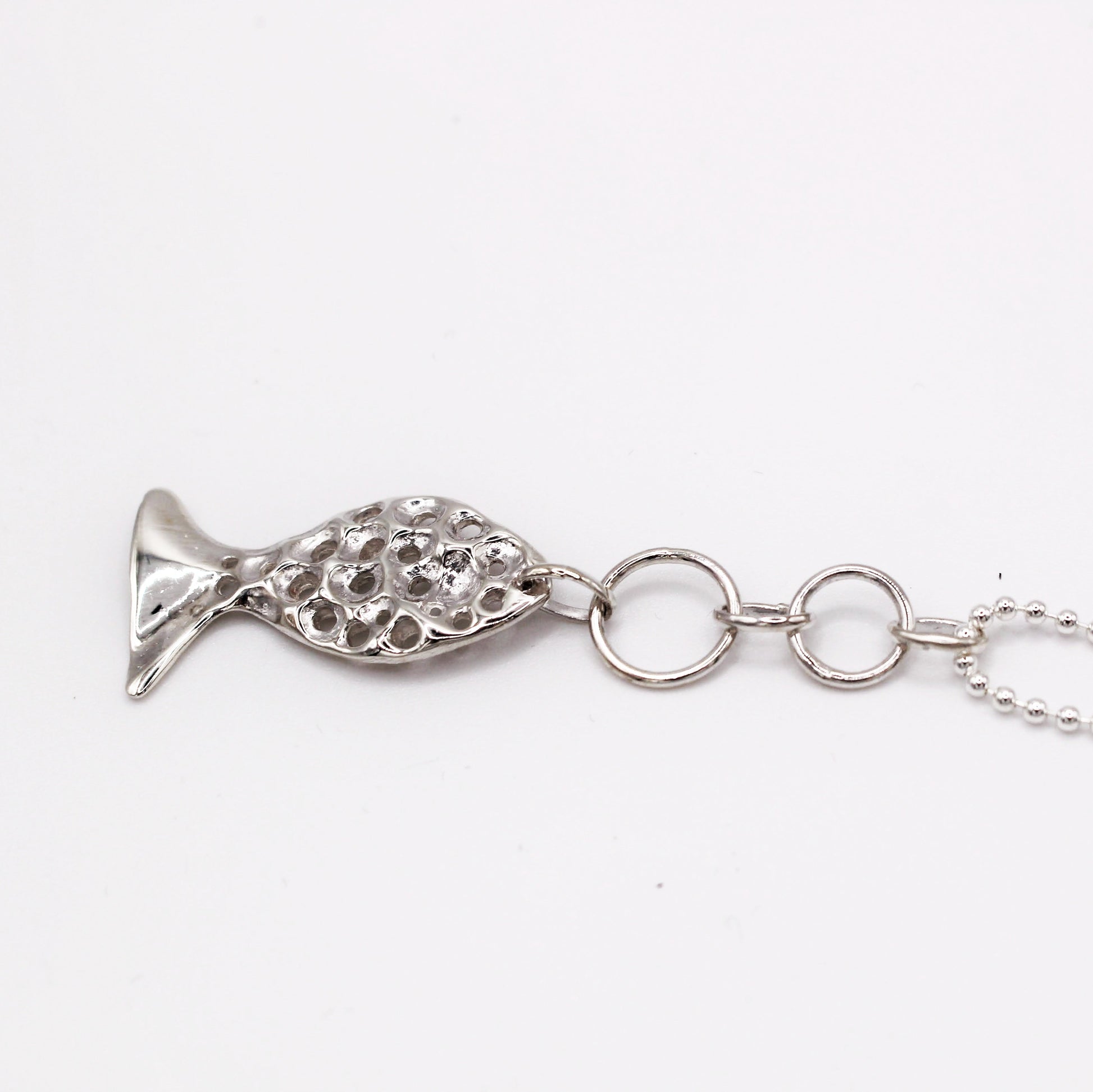 Sterling silver fish pendant, handcrafted using the lost wax casting technique. Unique Mediterranean-inspired jewelry, perfect for ocean lovers and sustainable fashion enthusiasts. Ethical and nature-inspired design, capturing the beauty of marine life in recycled silver