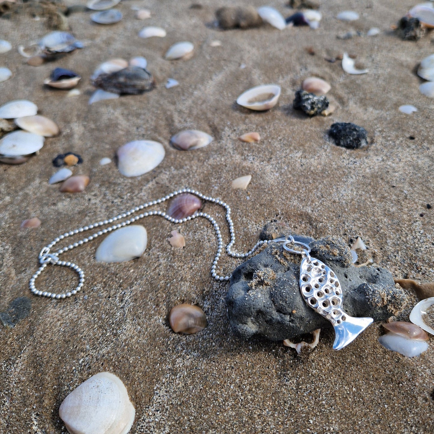 Sterling silver fish pendant, handcrafted using the lost wax casting technique. Unique Mediterranean-inspired jewelry, perfect for ocean lovers and sustainable fashion enthusiasts. Ethical and nature-inspired design, capturing the beauty of marine life in recycled silver
