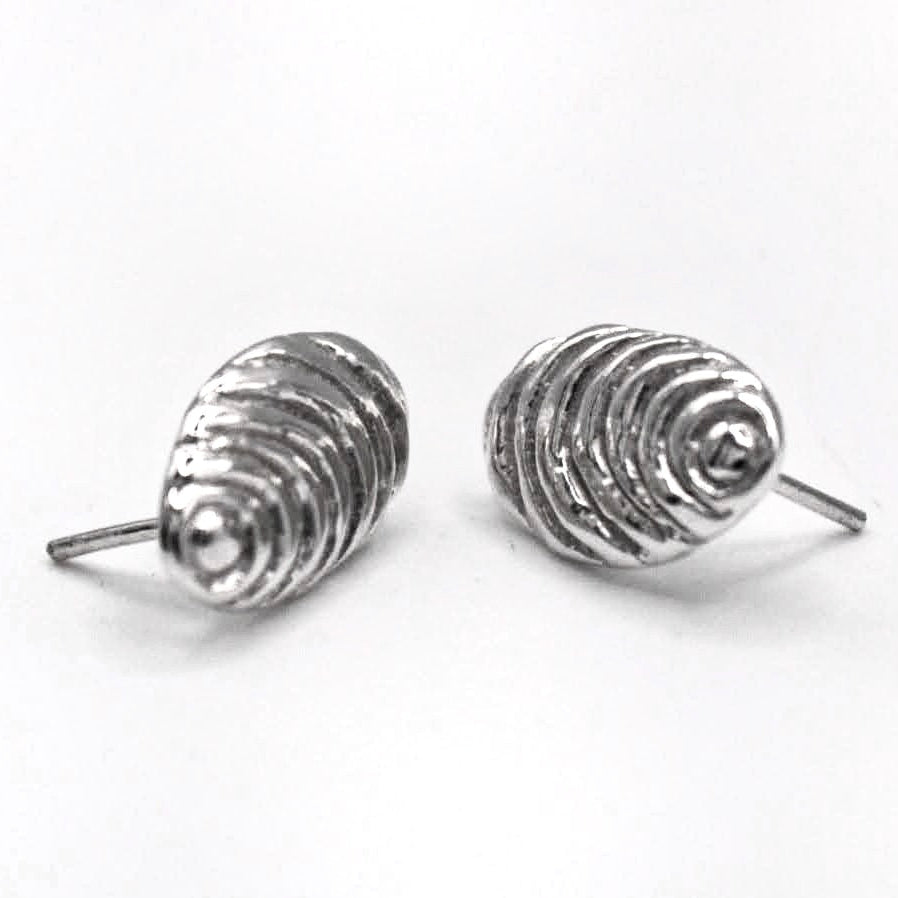 Organic sterling silver sun stud earrings textured oval handmade in Spain