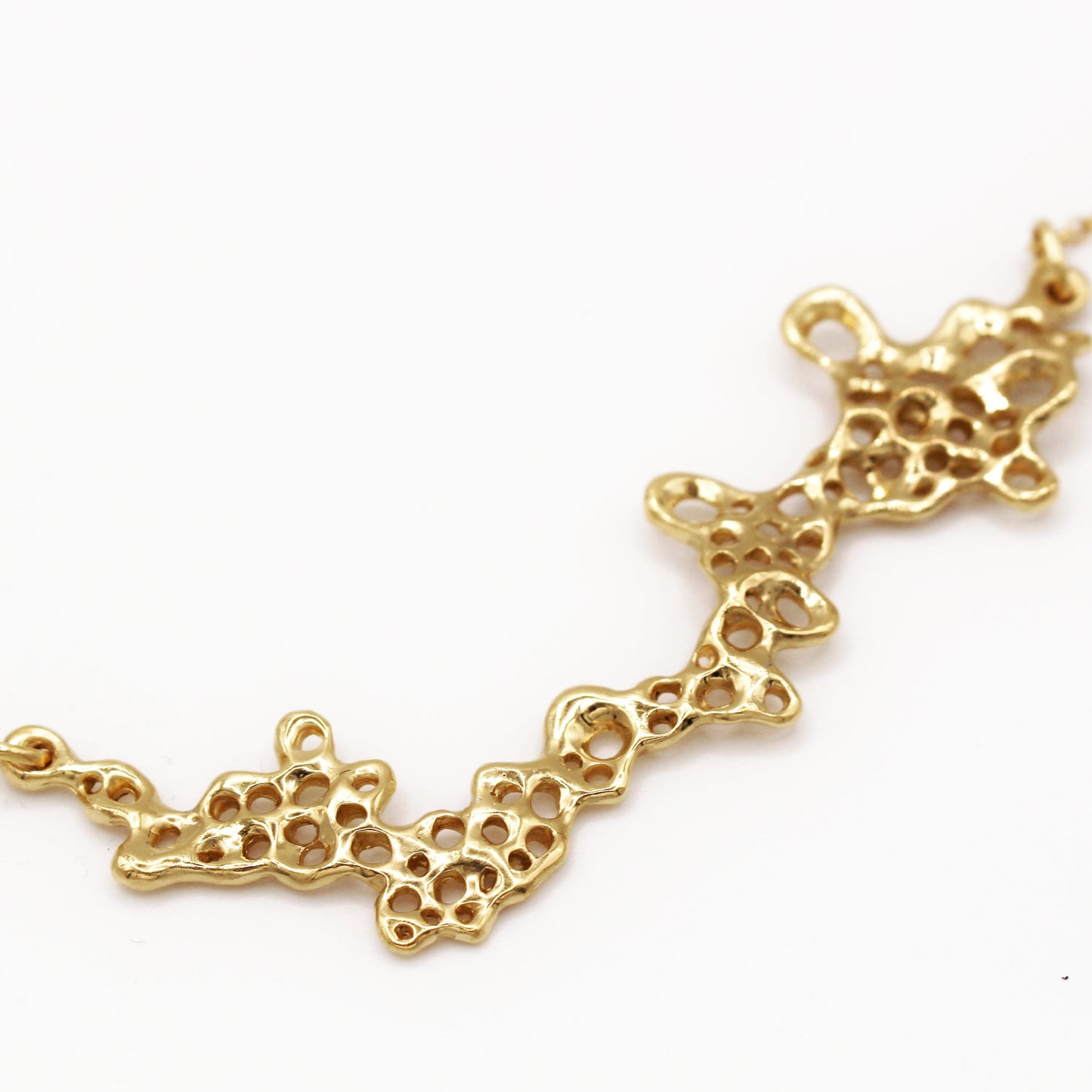 Gold plated barnacle necklace with sculptural design, meaningful statement jewelry