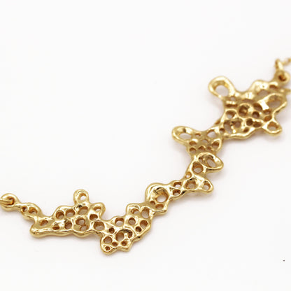 Gold plated barnacle necklace with sculptural design, meaningful statement jewelry