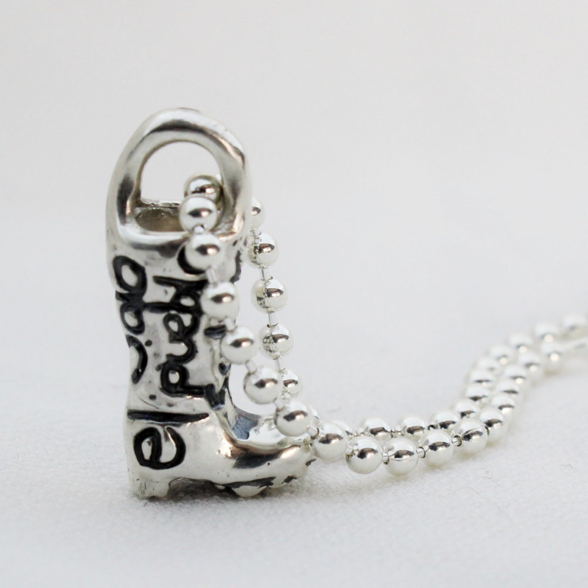 Sterling Silver 925 Beaded Chain Necklace with Solidarity Charm Silver 925 Rain Boot with engraved message Solo el Pueblo Salva al Pueblo