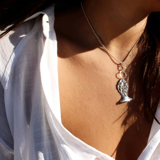 Sterling silver fish pendant, handcrafted using the lost wax casting technique. Unique Mediterranean-inspired jewelry, perfect for ocean lovers and sustainable fashion enthusiasts. Ethical and nature-inspired design, capturing the beauty of marine life in recycled silver