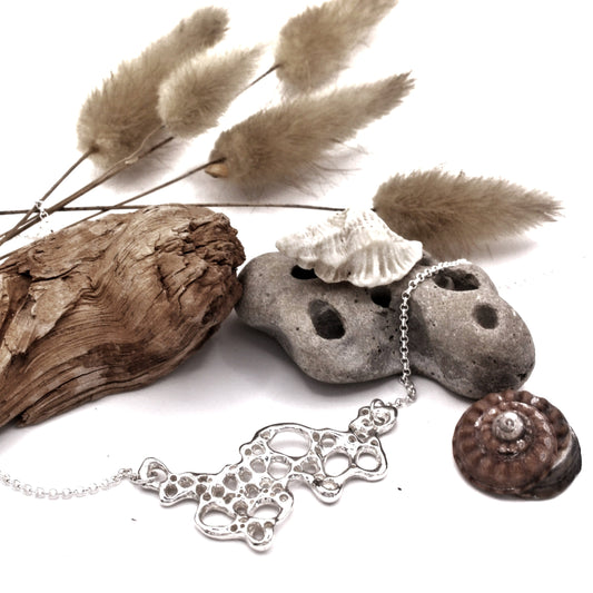 Silver seafoam pendant from the Raíz Collection, symbolic jewelry reminding to appreciate the moment