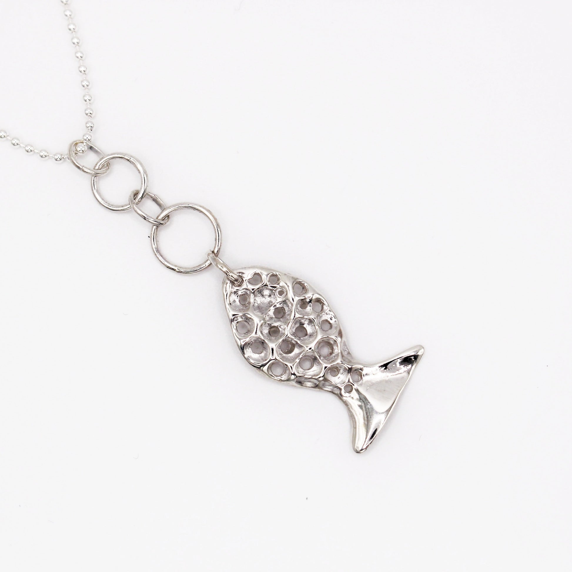 Mediterranean silver necklace with organic fish pendant symbolizing guidance and protection by Naturalesa Jewelry