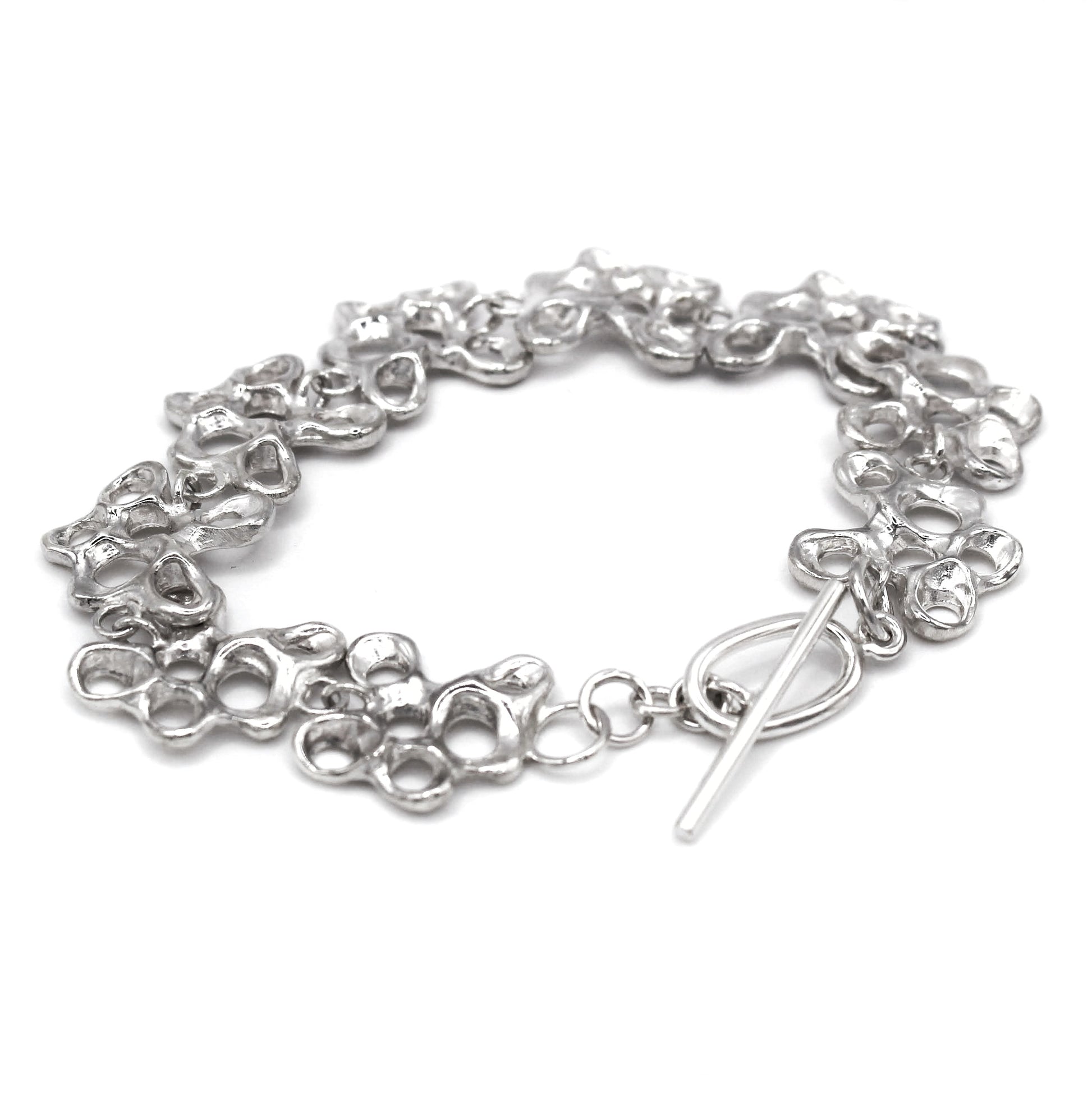 Statement silver bracelet inspired by Mediterranean sea life, artisan symbolic jewelry toggle clasp