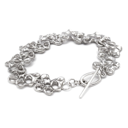 Statement silver bracelet inspired by Mediterranean sea life, artisan symbolic jewelry toggle clasp